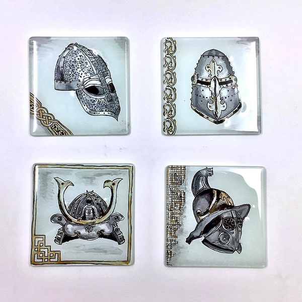 A set of coasters with helms from four different cultures and eras